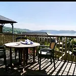 Fantastic Spacious House With Beautiful Panoramic Views Of The Bay Only A Few Minutes Walk From Beach Harbour And Restaurants This House Has 3 Bedrooms 3 Bathrooms And 2 Lovely Sitting Rooms