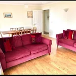Fantastic Spacious House With Beautiful Panoramic Views Of The Bay Only A Few Minutes Walk From Beach Harbour And Restaurants This House Has 3 Bedrooms 3 Bathrooms And 2 Lovely Sitting Rooms