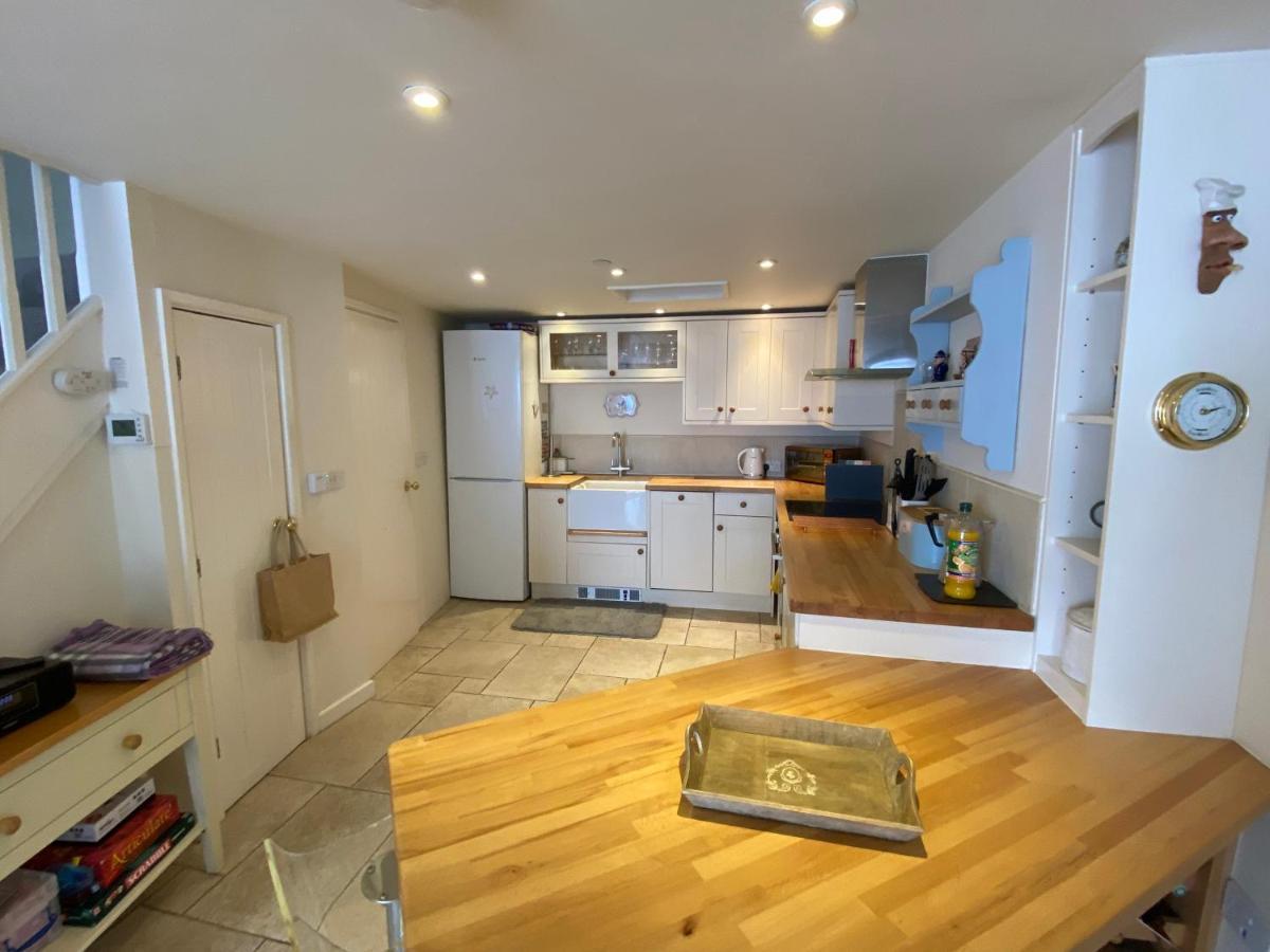 Holiday home Coastal Mill Cottage: 3-story Retreat With Rooftop Oasis *